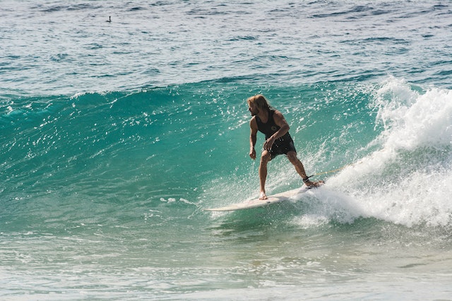 person on a surf board riding a wave